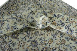 Surface texture of 2000s Kashan rug with natural Wool and intricate pattern