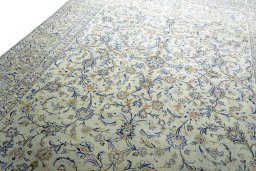 Backside of handmade 2000s Kashan rug showing knot structure and weave density