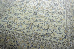 Close-up detail of 2000s Kashan rug from Iran / Persia showing Wool weave