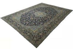 Corner detail of 2000s Kashan rug showing border pattern and Wool pile