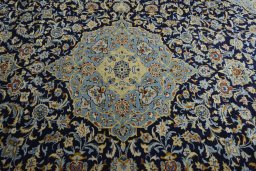 Central medallion detail of 2000s Kashan rug from Iran / Persia