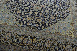 Close-up detail of 2000s Kashan rug from Iran / Persia showing Wool weave