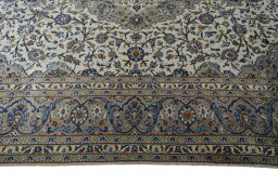 Corner detail of 2000s Kashan rug showing border pattern and Wool pile