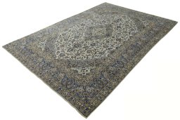 Corner detail of 2000s Kashan rug showing border pattern and Wool pile