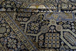 Close-up detail of 2000s Kashan rug from Iran / Persia showing Wool weave