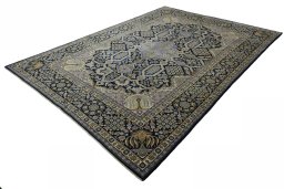 Corner detail of 2000s Kashan rug showing border pattern and Wool pile