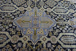 Central medallion detail of 2000s Kashan rug from Iran / Persia