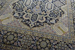 Close-up detail of 2000s Kashan rug from Iran / Persia showing Wool weave