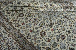 Close-up detail of 2000s Kashan rug from Iran / Persia showing Wool weave