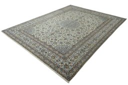 Corner detail of 2000s Kashan rug showing border pattern and Wool pile