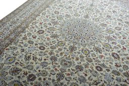 Backside of handmade 2000s Kashan rug showing knot structure and weave density
