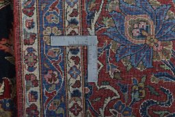 Backside of handmade 1930s Kashan rug showing knot structure and weave density
