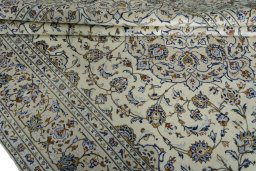 Close-up detail of 2000s Kashan rug from Iran / Persia showing Wool weave