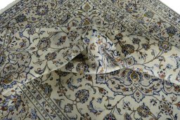 Surface texture of 2000s Kashan rug with natural Wool and intricate pattern