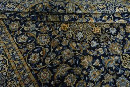 Close-up detail of 2000s Kashan rug from Iran / Persia showing Wool weave