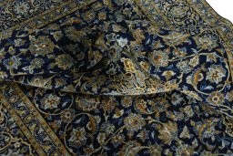 Surface texture of 2000s Kashan rug with natural Wool and intricate pattern