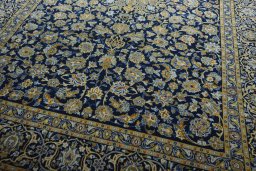 Close-up detail of 2000s Kashan rug from Iran / Persia showing Wool weave