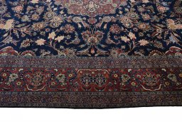 Corner detail of 1930s Kashan rug showing border pattern and Wool pile