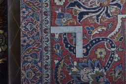 Backside of handmade 1930s Kashan rug showing knot structure and weave density