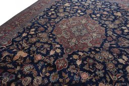 Backside of handmade 1930s Kashan rug showing knot structure and weave density
