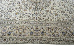 Corner detail of New Kashan rug showing border pattern and Wool pile