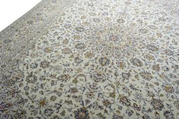 Backside of handmade New Kashan rug showing knot structure and weave density
