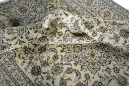 Surface texture of 2000s Kashan rug with natural Wool and intricate pattern