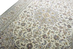 Backside of handmade 2000s Kashan rug showing knot structure and weave density