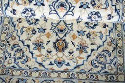 Close-up detail of New Kashan rug from Iran / Persia showing Wool weave