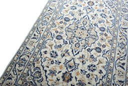 Backside of handmade New Kashan rug showing knot structure and weave density