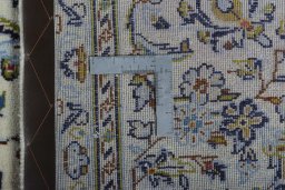 Surface texture of 2000s Kashan rug with natural Wool and intricate pattern