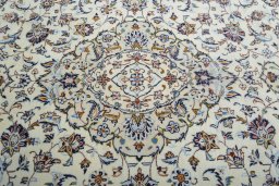 Backside of handmade 2000s Kashan rug showing knot structure and weave density