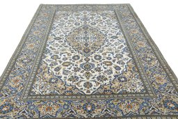 Surface texture of 2000s Kashan rug with natural Wool and intricate pattern