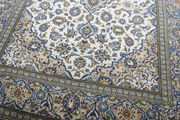 Close-up detail of 2000s Kashan rug from Iran / Persia showing Wool weave