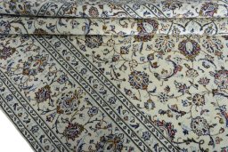 Close-up detail of 2000s Kashan rug from Iran / Persia showing Wool weave