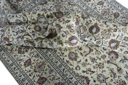 Surface texture of 2000s Kashan rug with natural Wool and intricate pattern