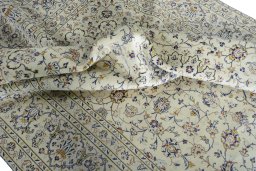 Surface texture of 2000s Kashan rug with natural Wool and intricate pattern