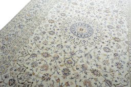 Backside of handmade 2000s Kashan rug showing knot structure and weave density