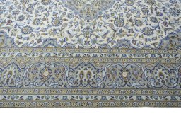 Corner detail of 2000s Kashan rug showing border pattern and Wool pile