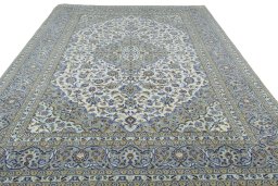 Surface texture of 2000s Kashan rug with natural Wool and intricate pattern