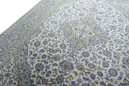 Backside of handmade 2000s Kashan rug showing knot structure and weave density