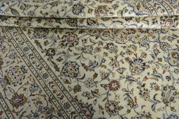 Close-up detail of 2000s Kashan rug from Iran / Persia showing Wool weave