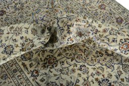 Surface texture of 2000s Kashan rug with natural Wool and intricate pattern