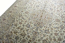 Backside of handmade 2000s Kashan rug showing knot structure and weave density