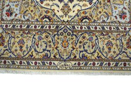 Corner detail of New Kashan rug showing border pattern and Cork pile