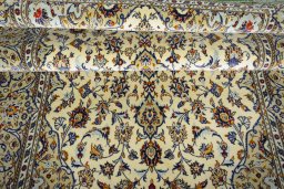 Surface texture of New Kashan rug with natural Cork and intricate pattern