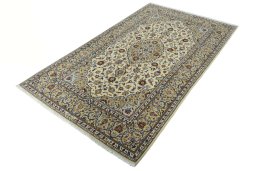 Corner detail of New Kashan rug showing border pattern and Cork pile
