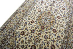 Backside of handmade New Kashan rug showing knot structure and weave density