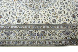 Corner detail of New Kashan rug showing border pattern and Cork pile