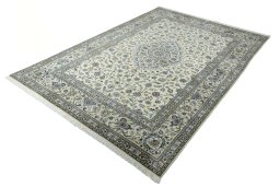 Corner detail of New Kashan rug showing border pattern and Cork pile